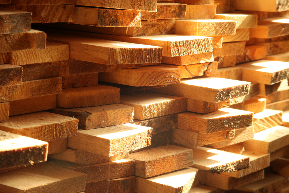 Scandinavian timber boards stacked in warm light